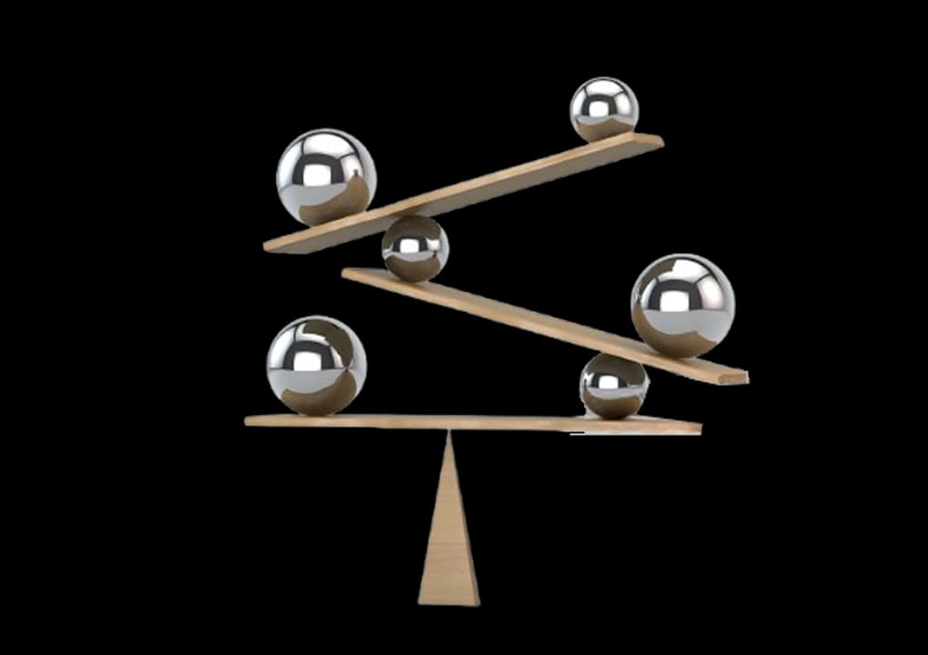 Balanced spheres representing a high-performing finance team